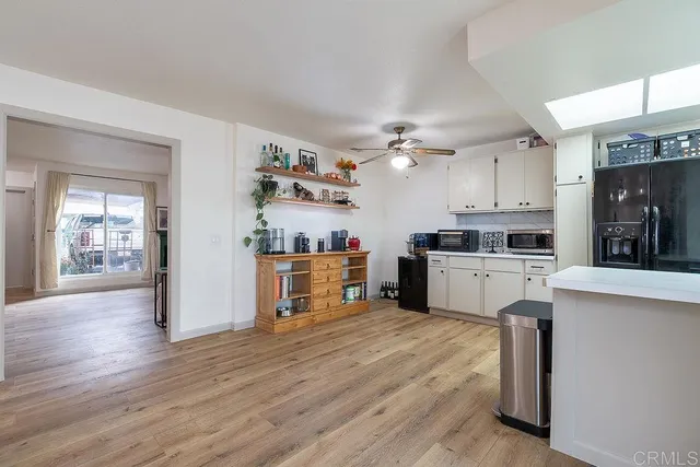 a kitchen with cabinets a sink and appliances
