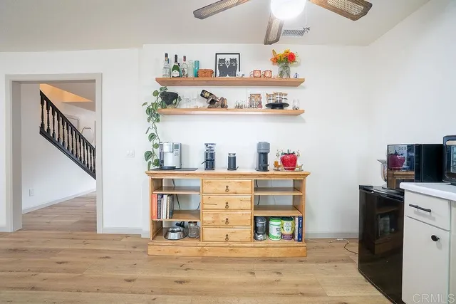 a view of kitchen and dining room with wooden floor