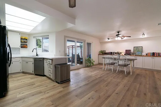 a kitchen with a table and chairs in it