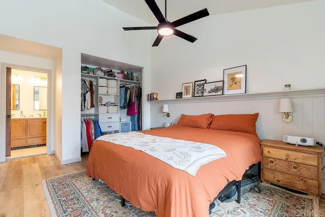 a bedroom with a bed and a walk in closet