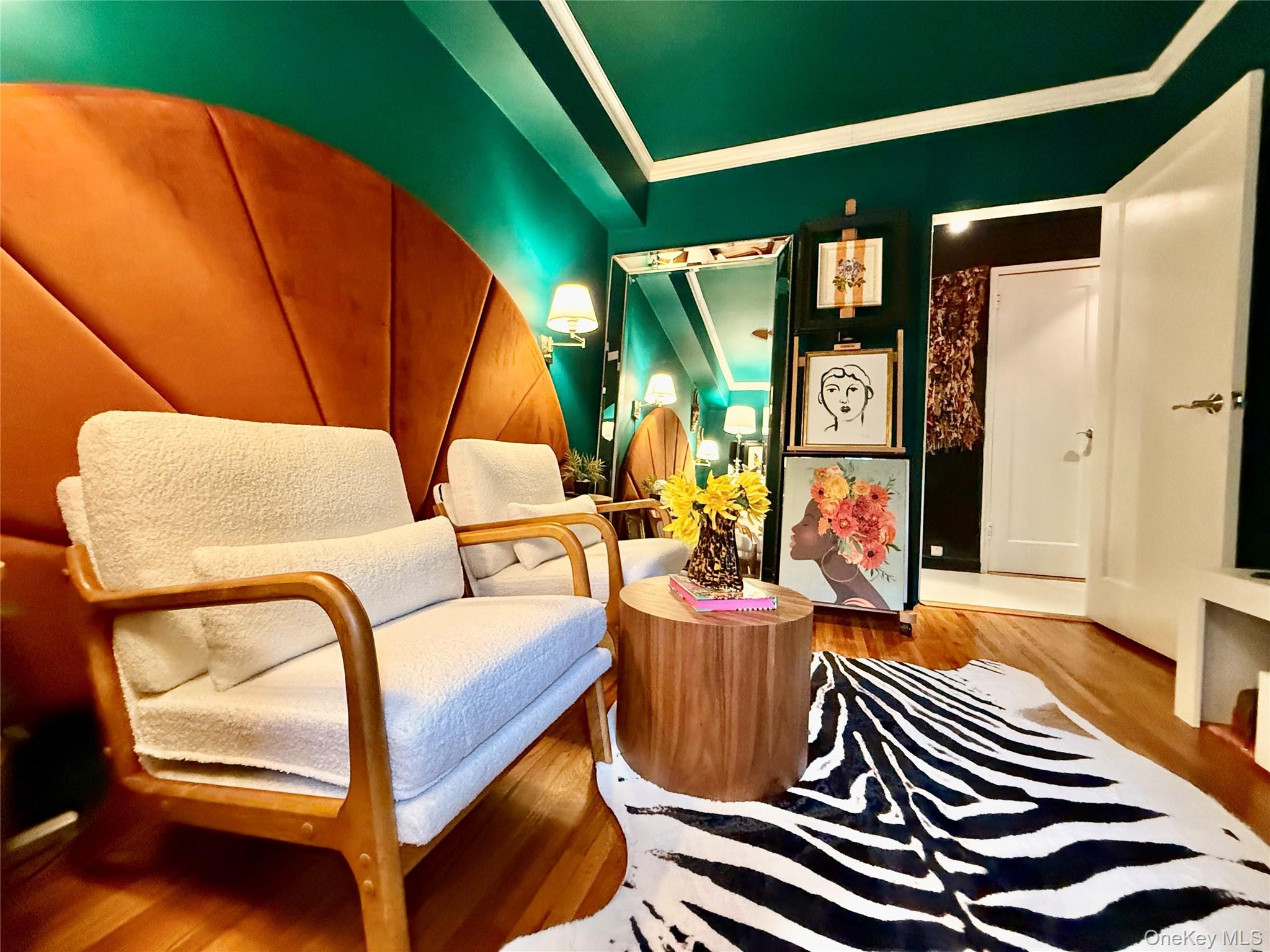 112-25 34th Avenue, Unit 2D Queens, NY 11368 - Photo 13 of 37 a living room with furniture a rug and a window