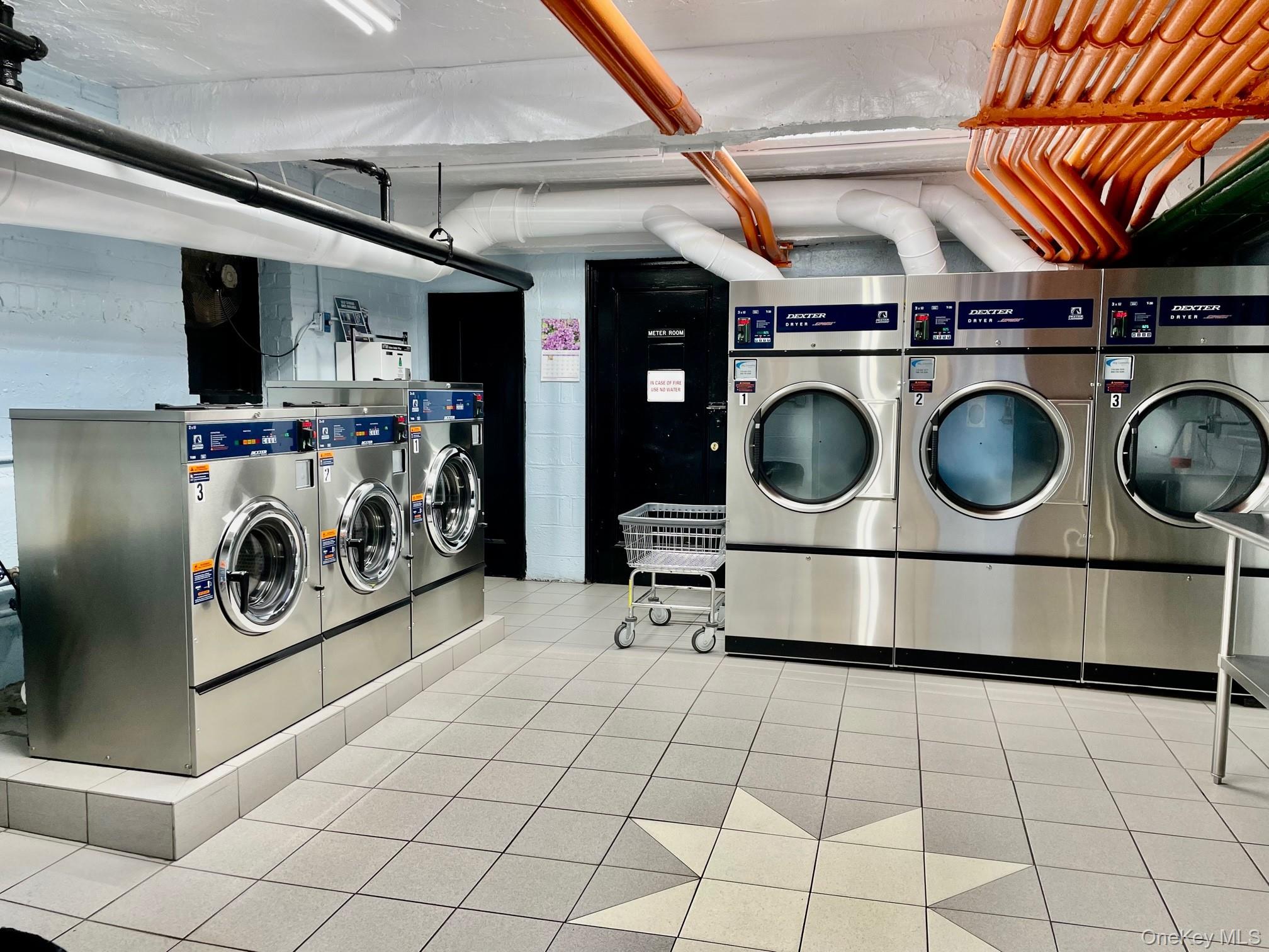 112-25 34th Avenue, Unit 2D Queens, NY 11368 - Photo 28 of 39 Laundry with tile floors. Renovated 2020 has sink and bathroom. Each building has laundry in the basement.