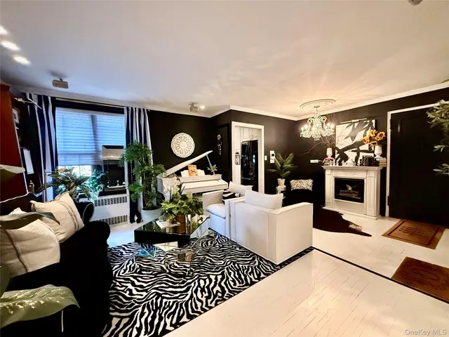 a living room with furniture a rug and a flat screen tv
