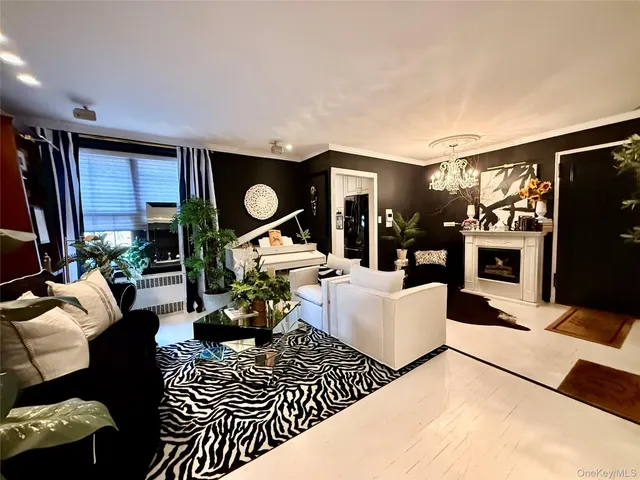 a living room with furniture a rug and a flat screen tv