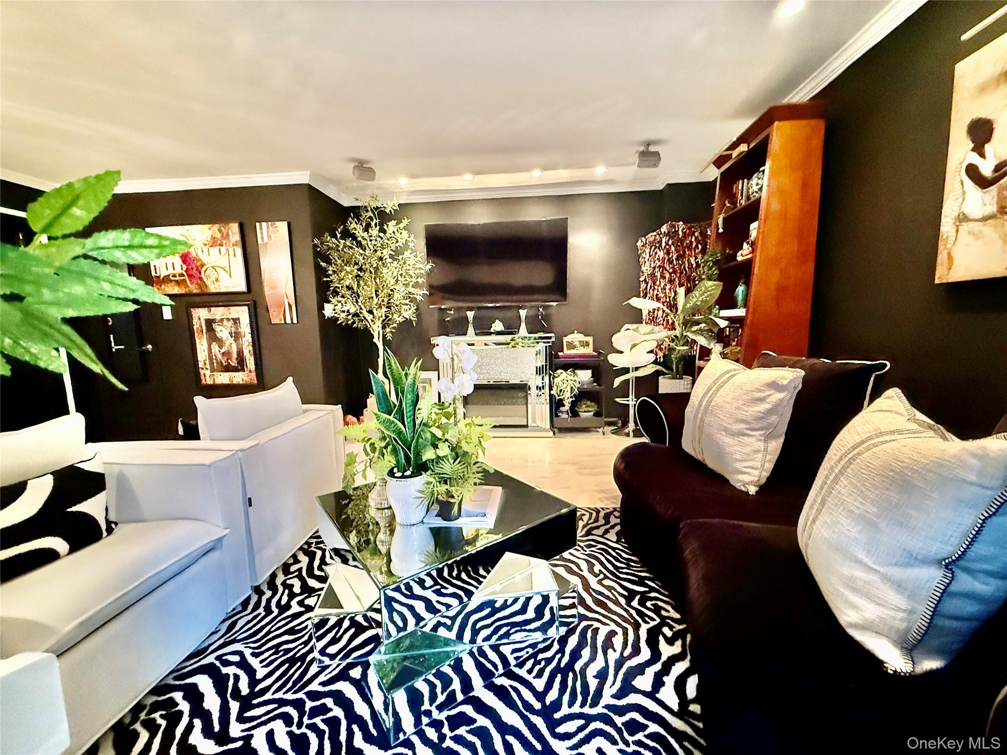 112-25 34th Avenue, Unit 2D Queens, NY 11368 - Photo 8 of 37 a living room with furniture potted plant and a large window