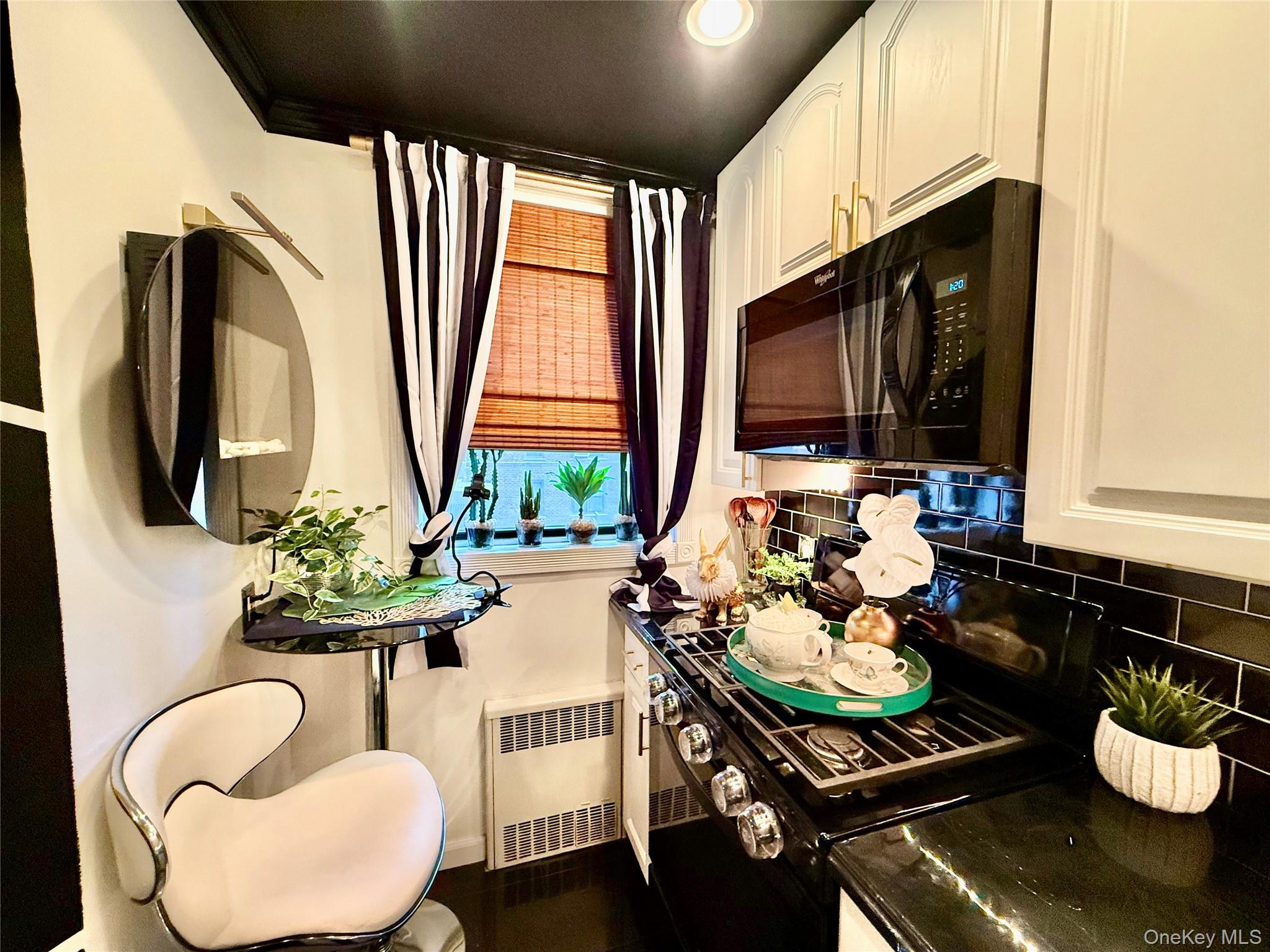 112-25 34th Avenue, Unit 2D Queens, NY 11368 - Photo 10 of 37 a living room with furniture and a flat screen tv