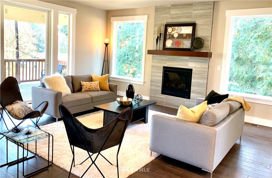 21632 2nd Court Southeast Bothell, WA 98021 - Photo 2 of 21 a living room with furniture and a fireplace