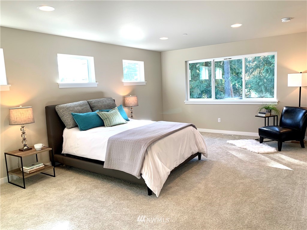 21632 2nd Court Southeast Bothell, WA 98021 - Photo 14 of 21 a bedroom with bed and a large window