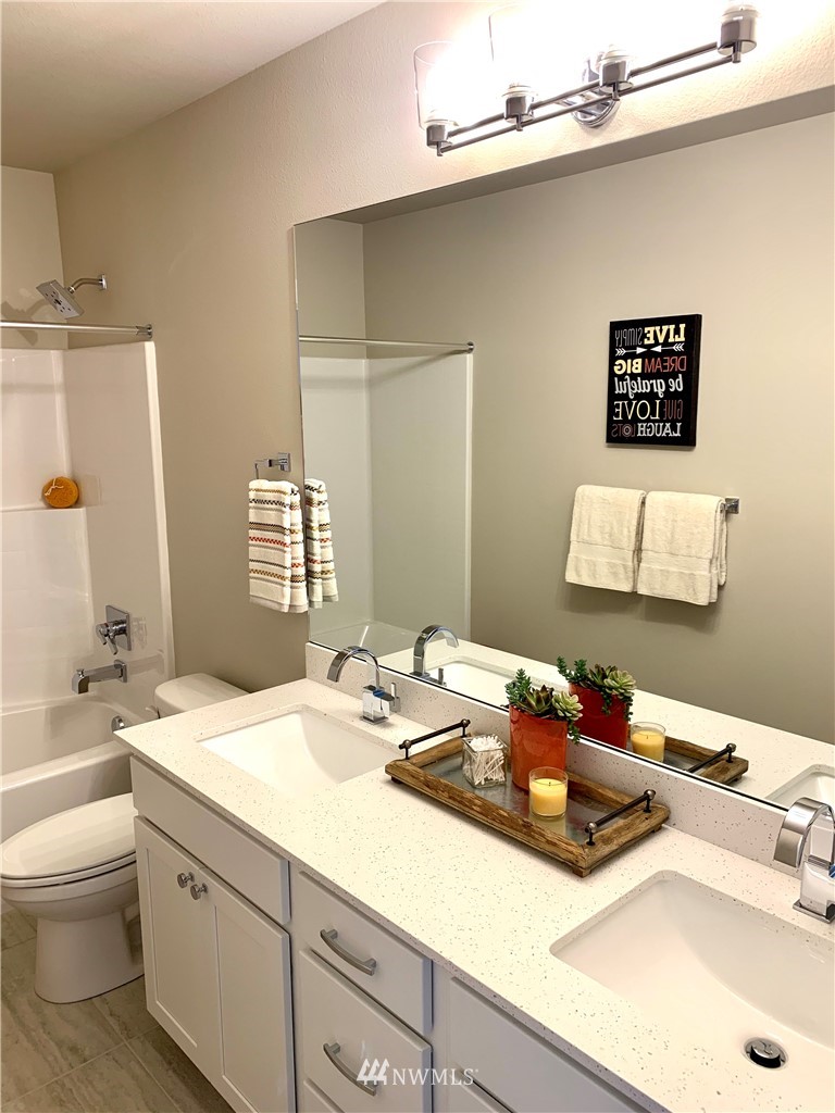 21632 2nd Court Southeast Bothell, WA 98021 - Photo 15 of 21 a bathroom with a sink and a mirror