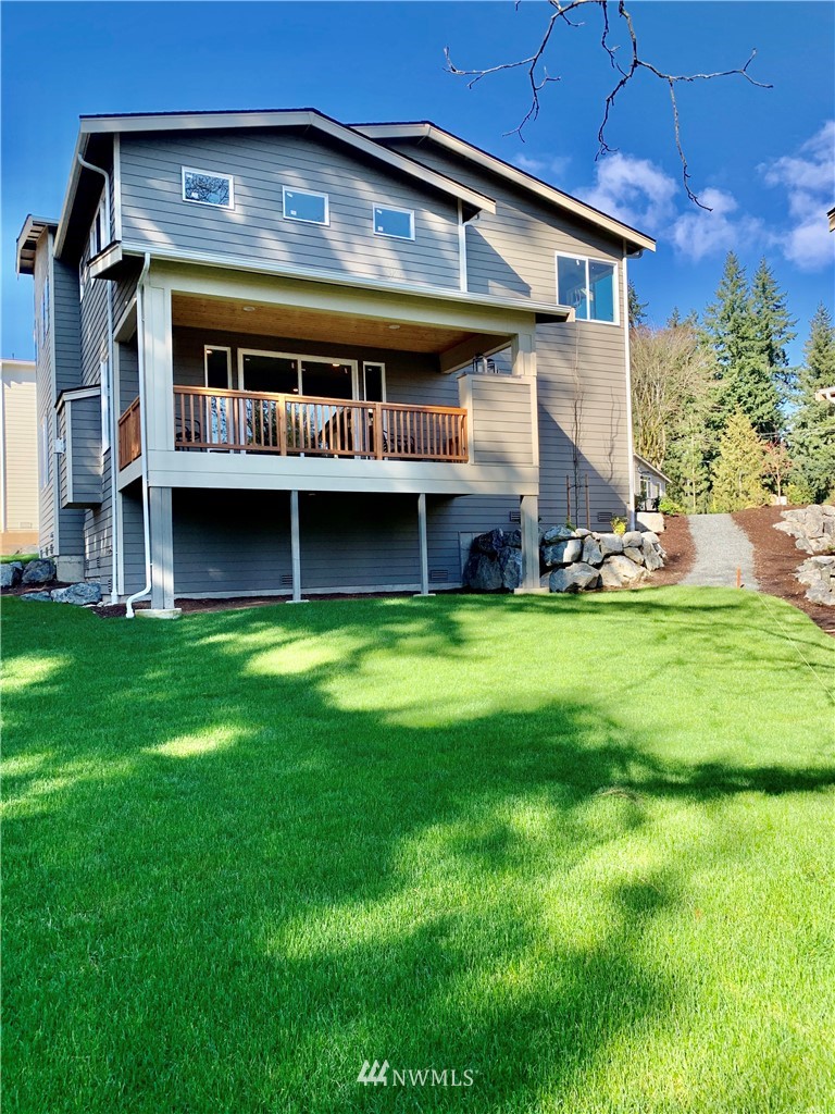 21632 2nd Court Southeast Bothell, WA 98021 - Photo 16 of 21 a view of an house with backyard space and balcony