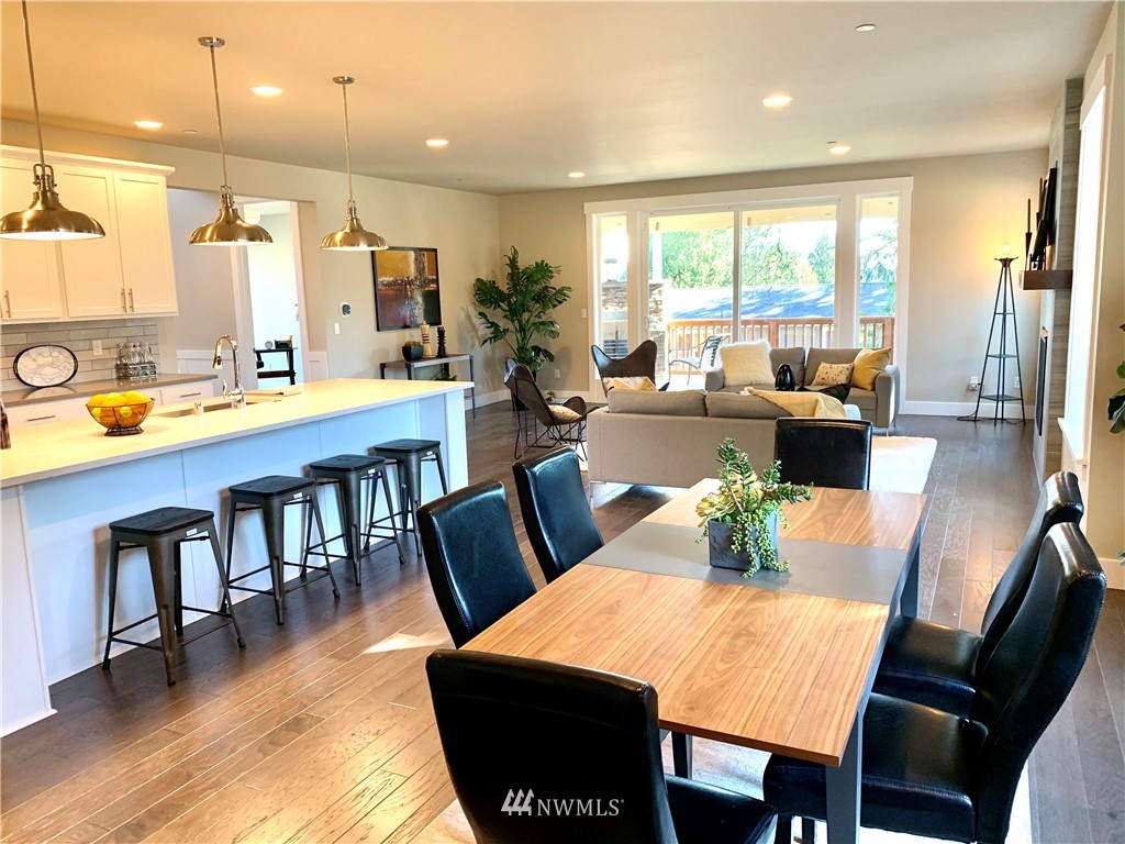 21632 2nd Court Southeast Bothell, WA 98021 - Photo 5 of 21 a view of a dining room with furniture window and wooden floor