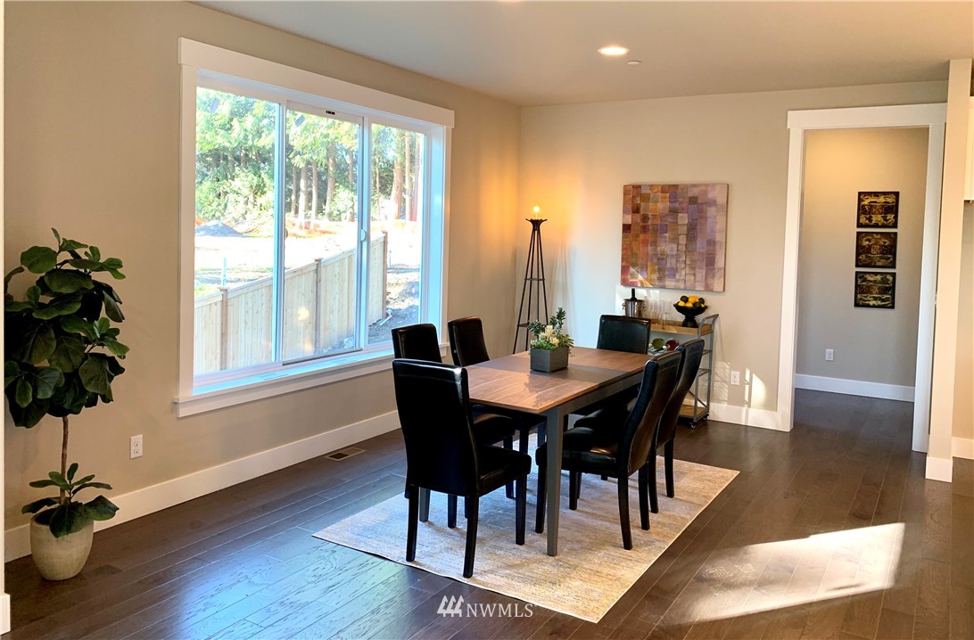 21632 2nd Court Southeast Bothell, WA 98021 - Photo 6 of 21 a view of a dining room with furniture window and wooden floor