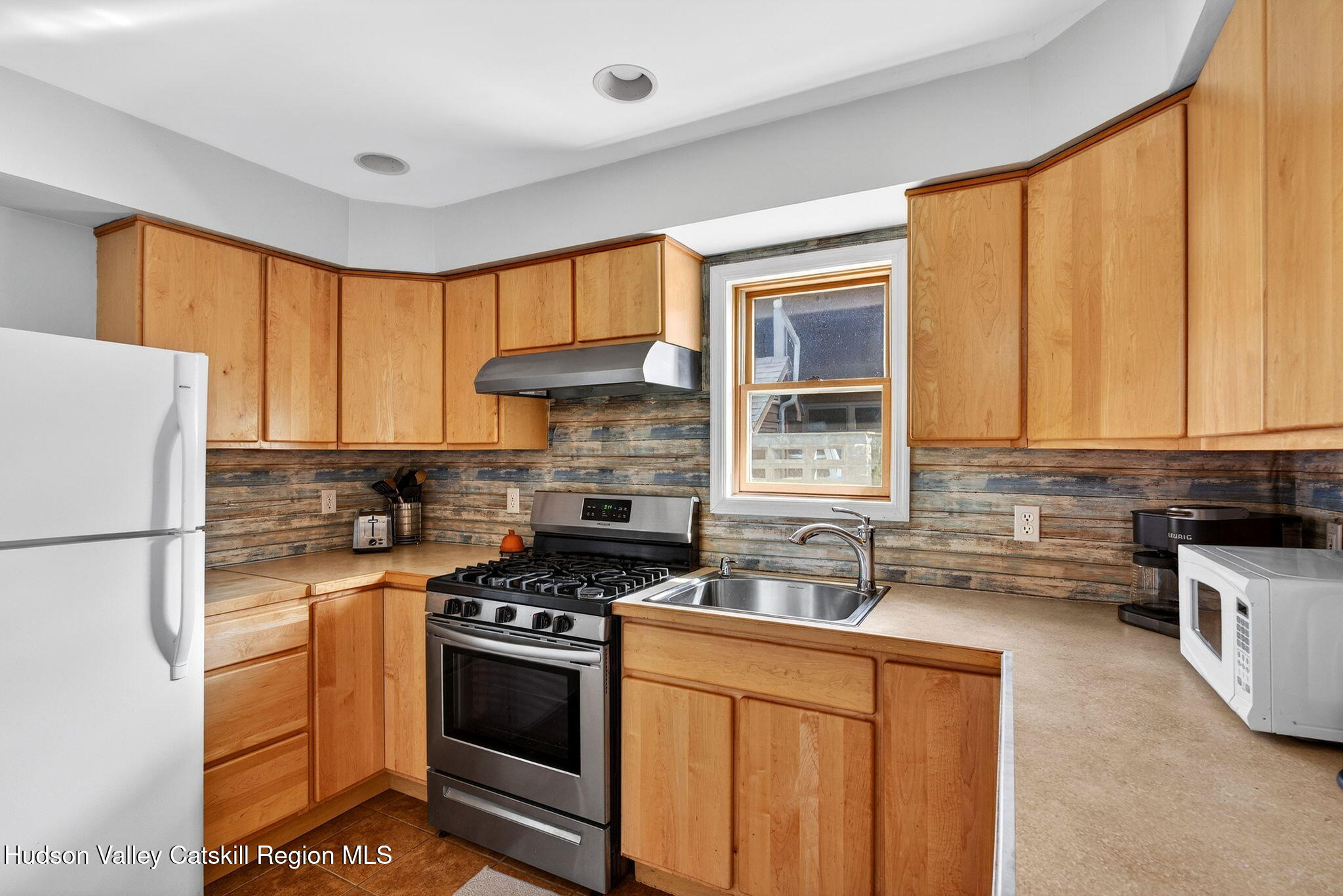 205 Esopus Creek Road Saugerties, NY 12477 - Photo 18 of 56 a kitchen with stainless steel appliances a stove a sink and a refrigerator