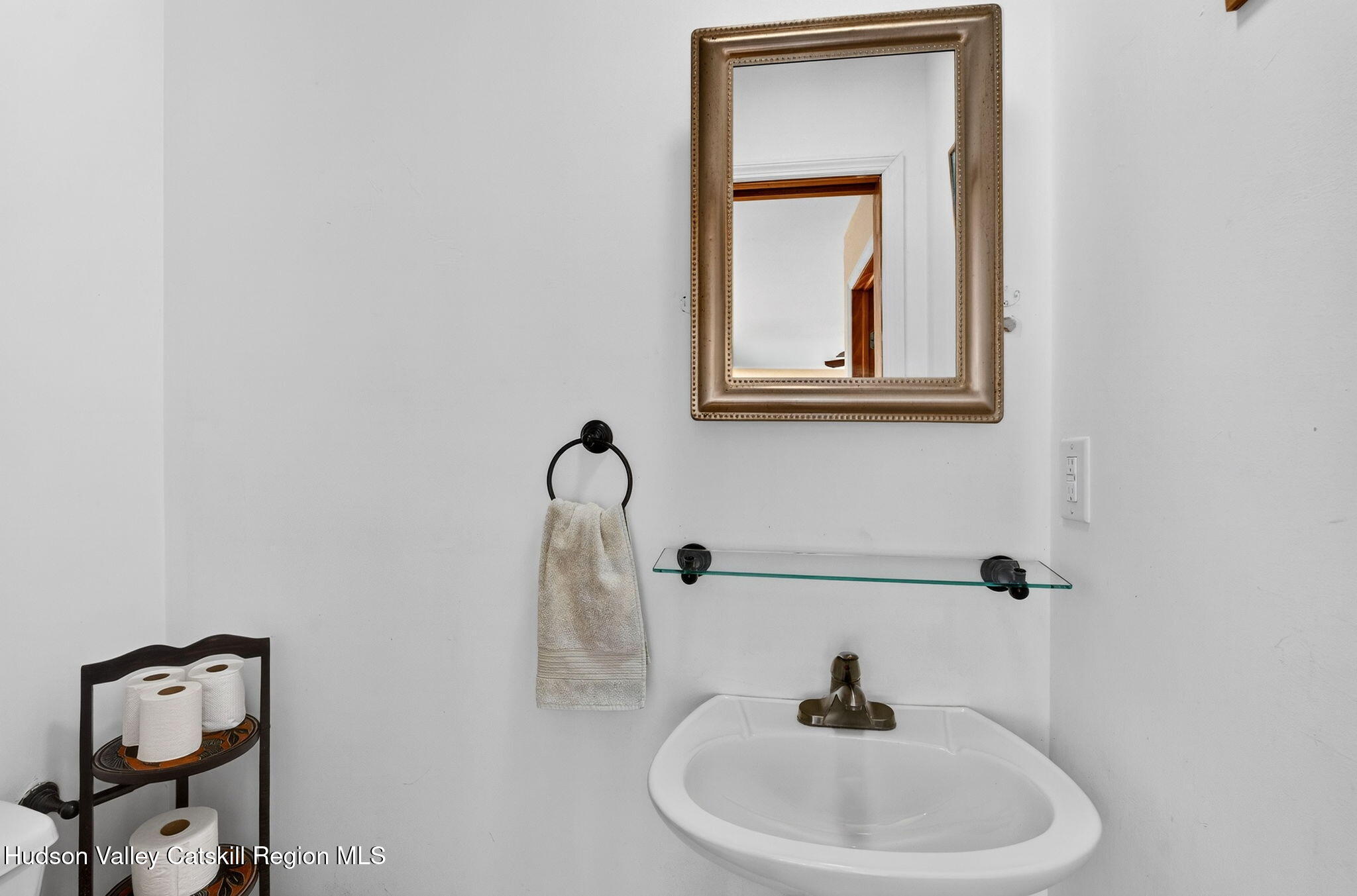 205 Esopus Creek Road Saugerties, NY 12477 - Photo 19 of 56 a bathroom with a sink and mirror