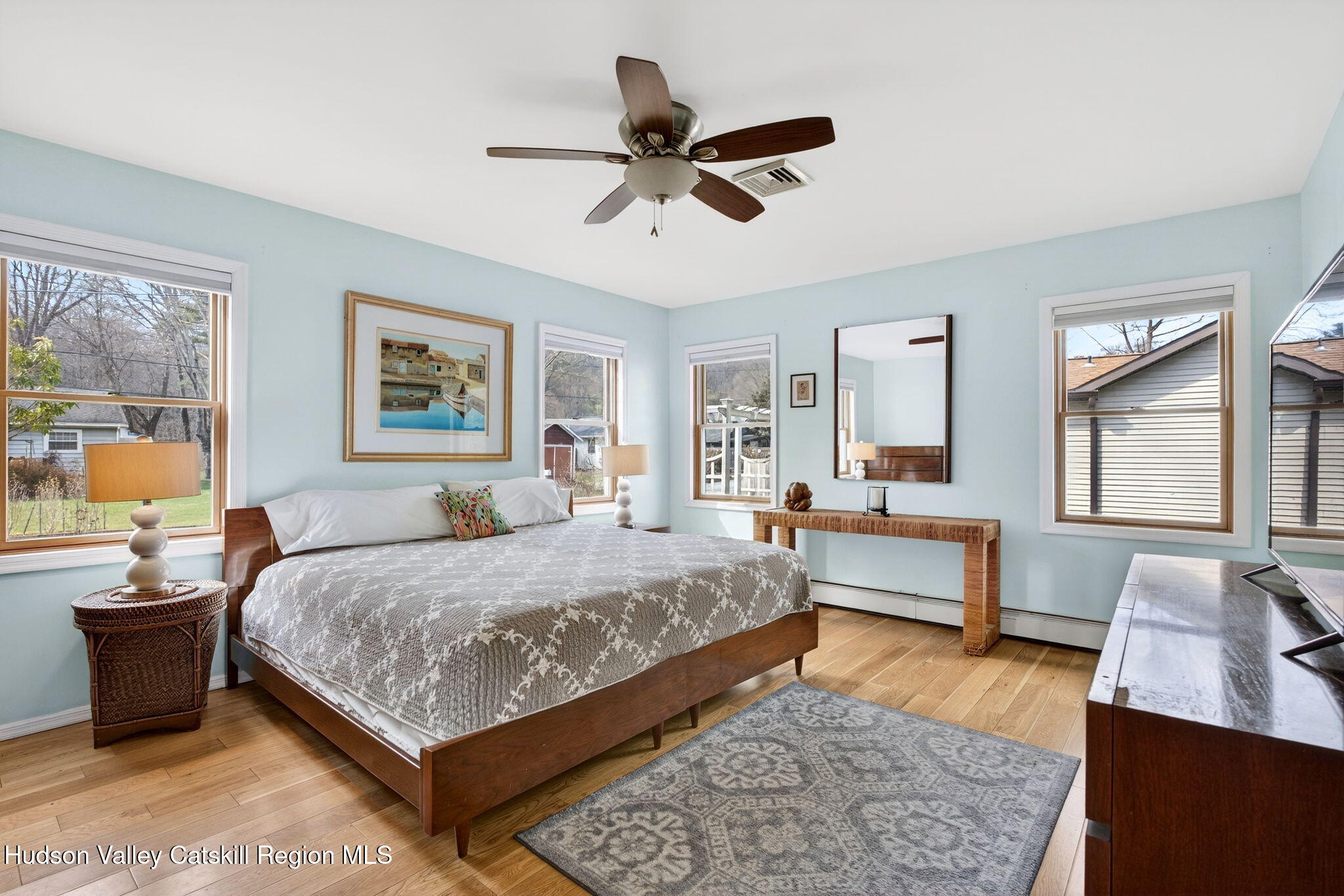 205 Esopus Creek Road Saugerties, NY 12477 - Photo 20 of 56 a bedroom with a bed and wooden floor