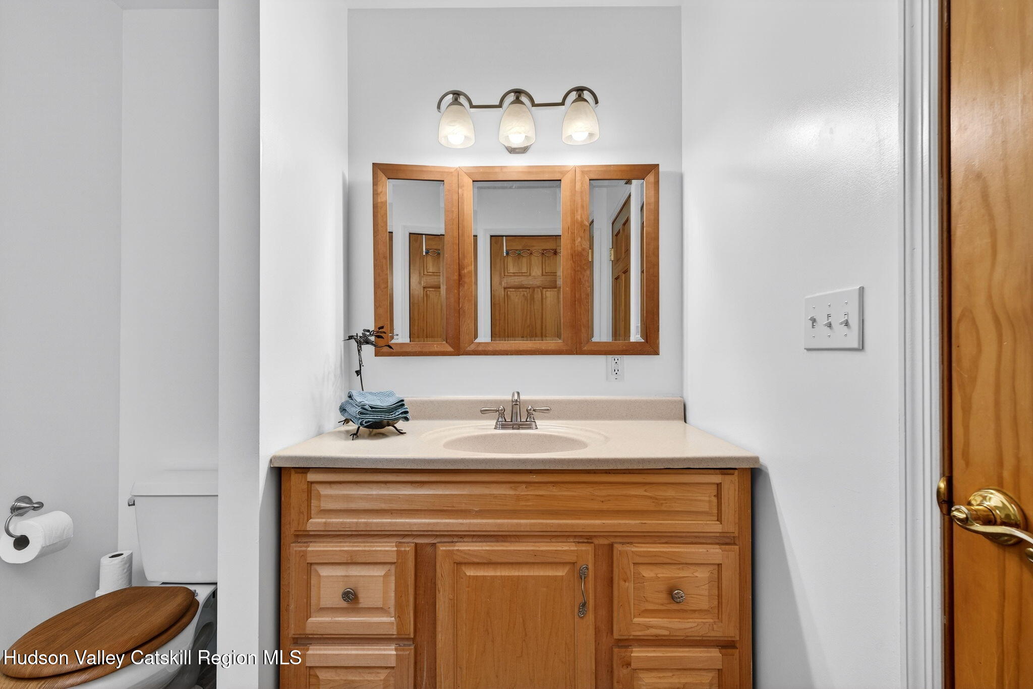 205 Esopus Creek Road Saugerties, NY 12477 - Photo 26 of 56 a bathroom with a sink and a mirror