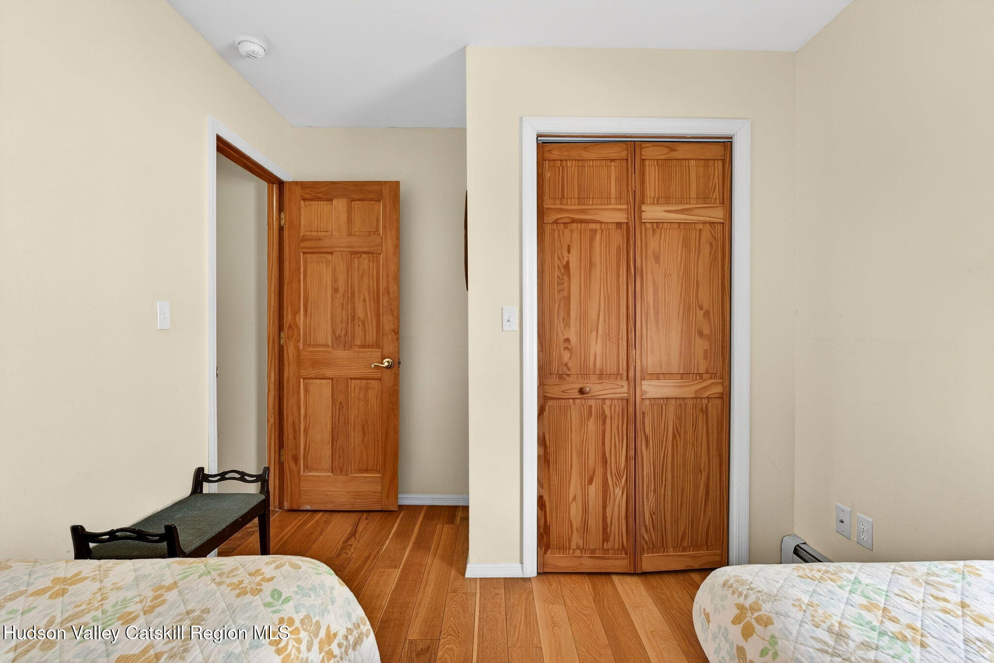 205 Esopus Creek Road Saugerties, NY 12477 - Photo 28 of 56 a bedroom with a bed and wooden floor