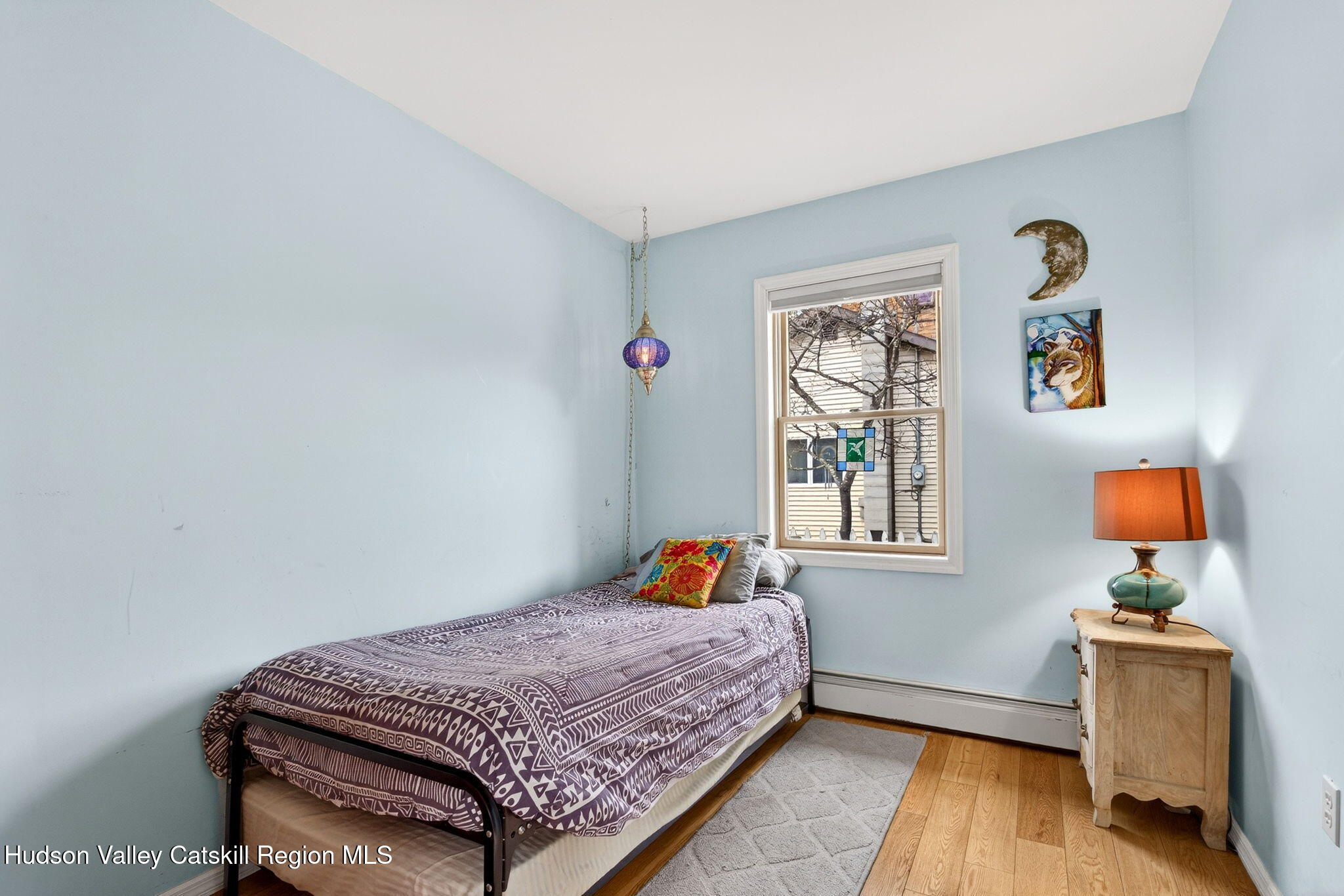205 Esopus Creek Road Saugerties, NY 12477 - Photo 29 of 56 a bedroom with a bed and wooden floor
