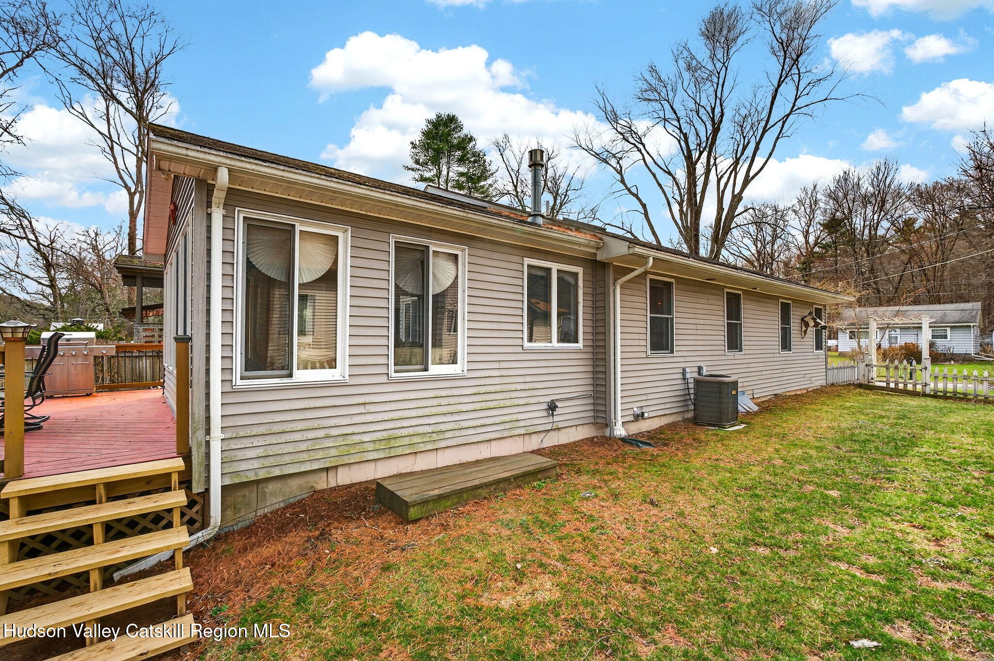 205 Esopus Creek Road Saugerties, NY 12477 - Photo 38 of 56 a backyard of a house with table and chairs