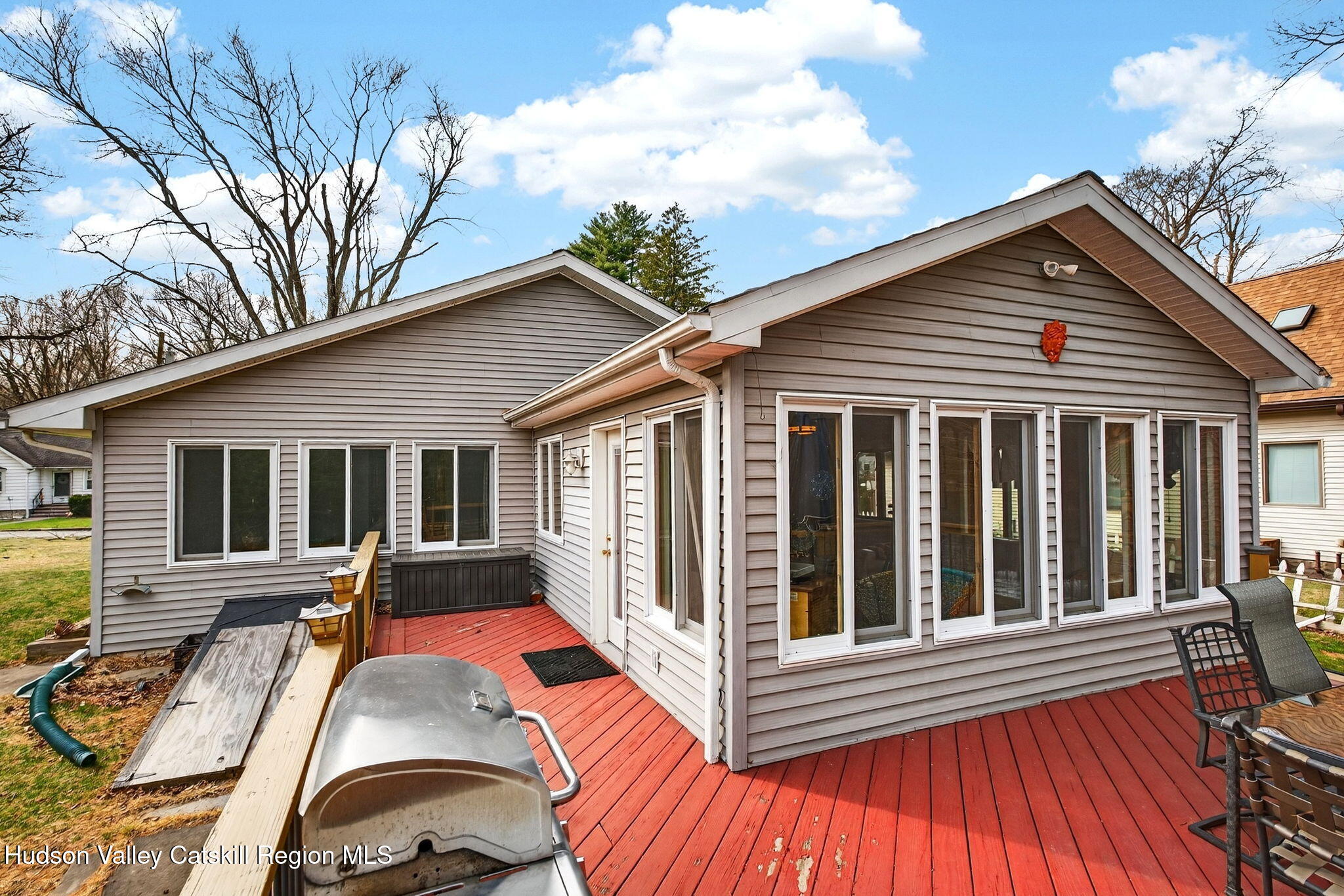 205 Esopus Creek Road Saugerties, NY 12477 - Photo 41 of 56 a view of a house with wooden deck and furniture