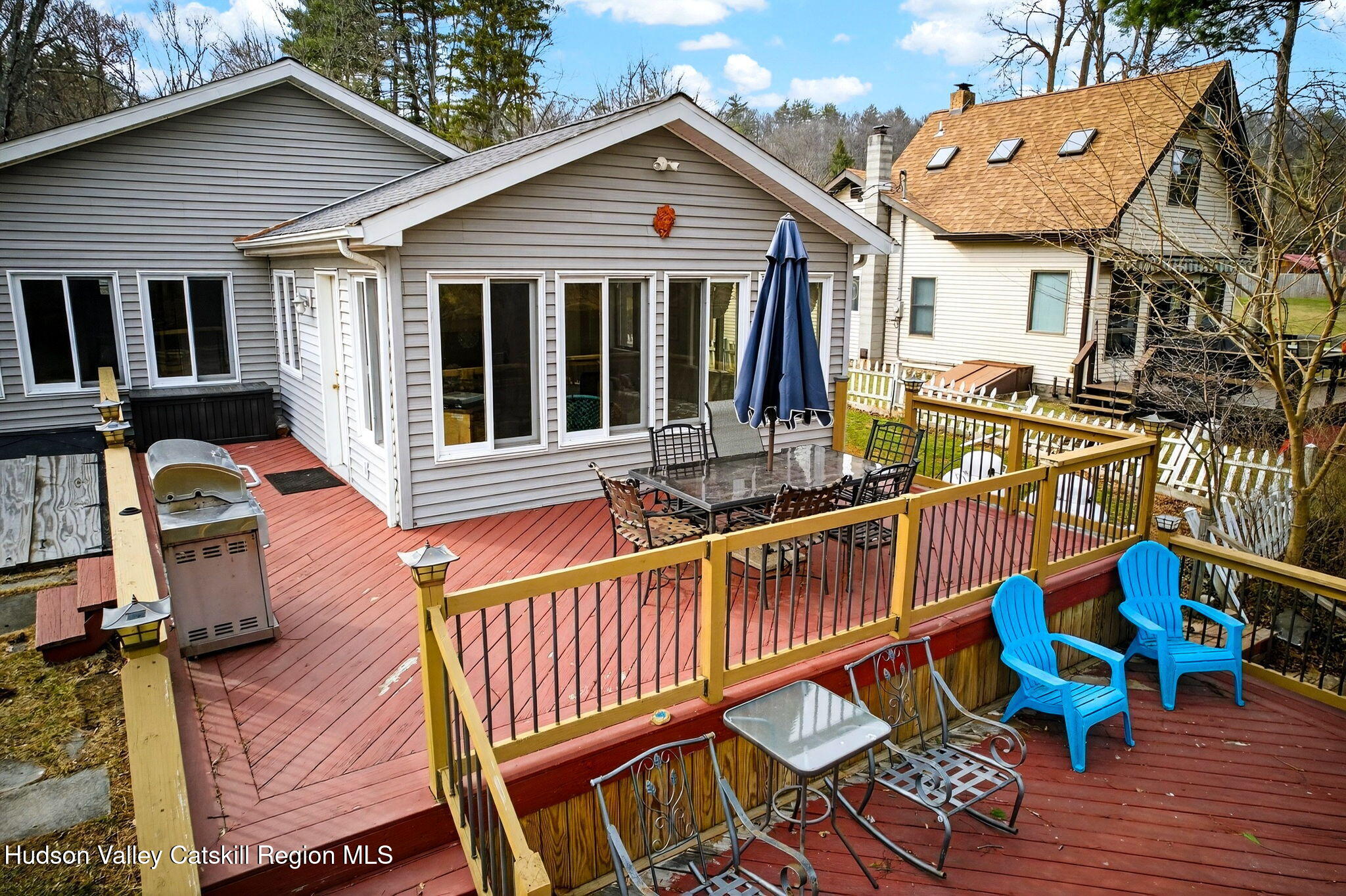205 Esopus Creek Road Saugerties, NY 12477 - Photo 43 of 56 a view of a house with a wooden deck