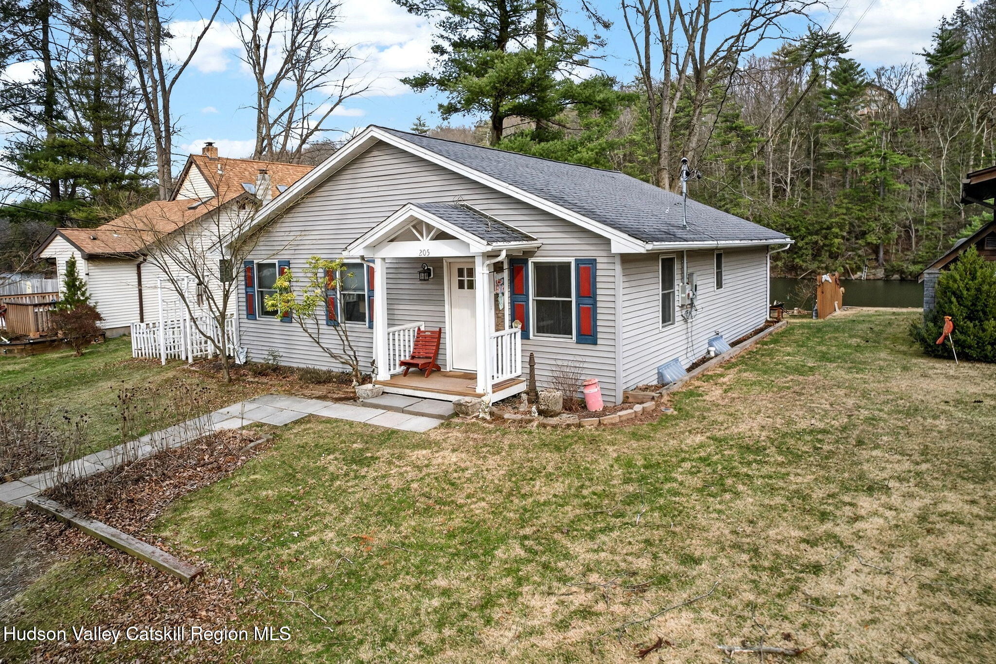 205 Esopus Creek Road Saugerties, NY 12477 - Photo 52 of 56 a view of a house with a yard and large trees
