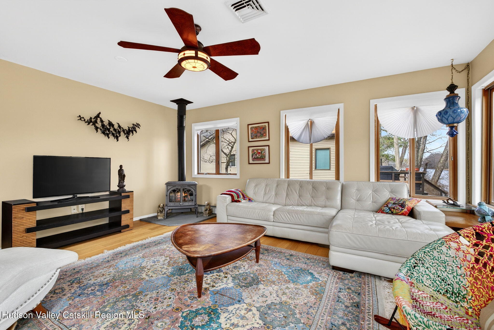 205 Esopus Creek Road Saugerties, NY 12477 - Photo 9 of 56 a living room with furniture a flat screen tv and a window