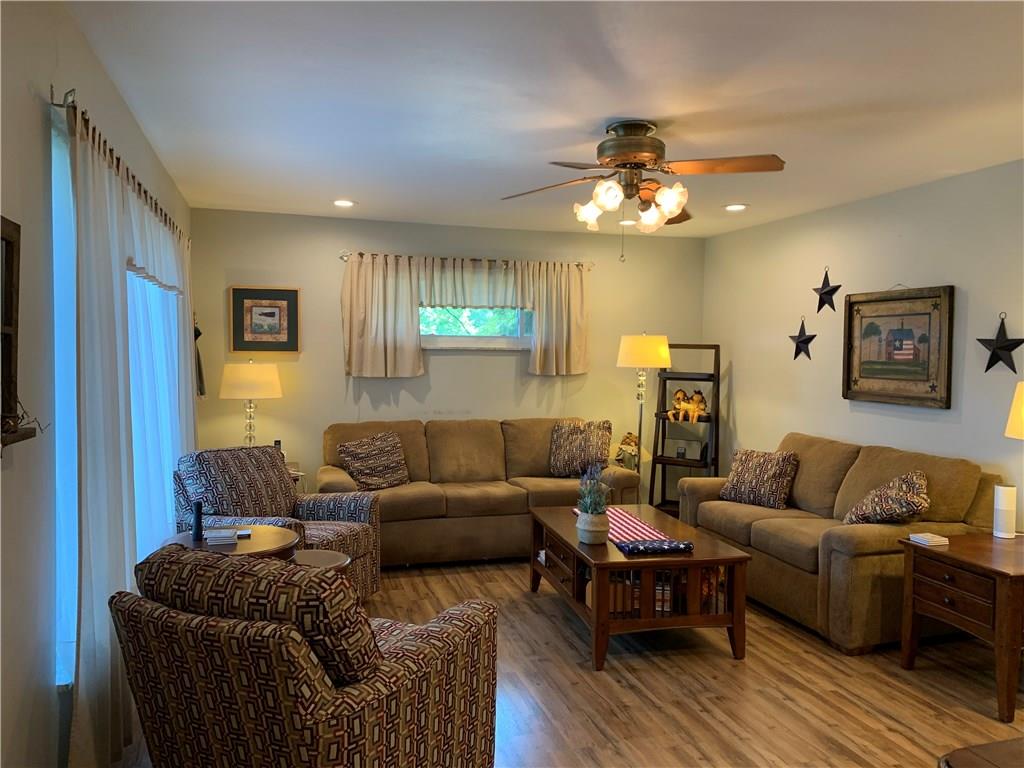 187 Warren Road Warrendale, PA 15086 - Photo 2 of 16 Living room with large windows for natural light and a ceiling fan.