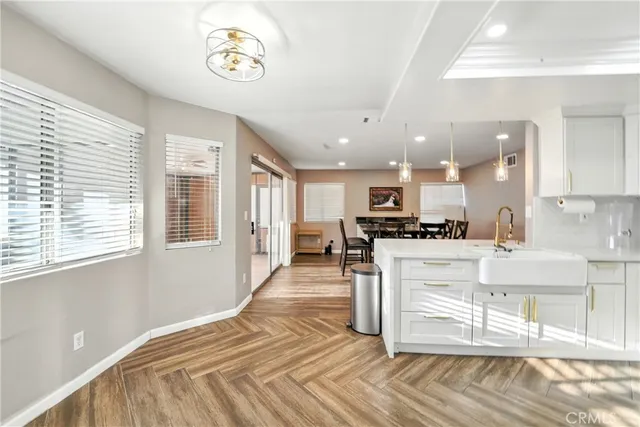 a view of kitchen with furniture and wooden floor