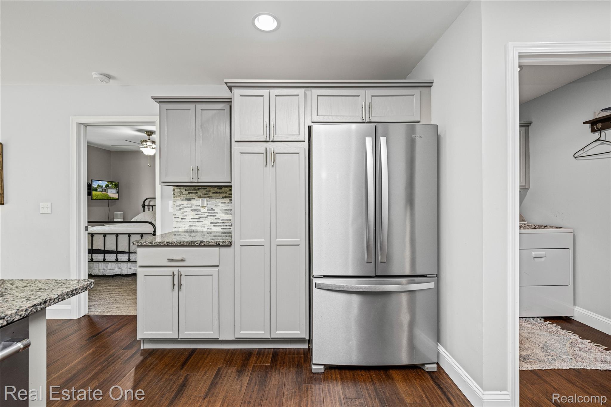 2479 Gibson Road Grand Blanc, MI 48439 - Photo 27 of 55 Contemporary kitchen featuring light gray cabinetry, a stainless steel French door refrigerator, and granite countertops