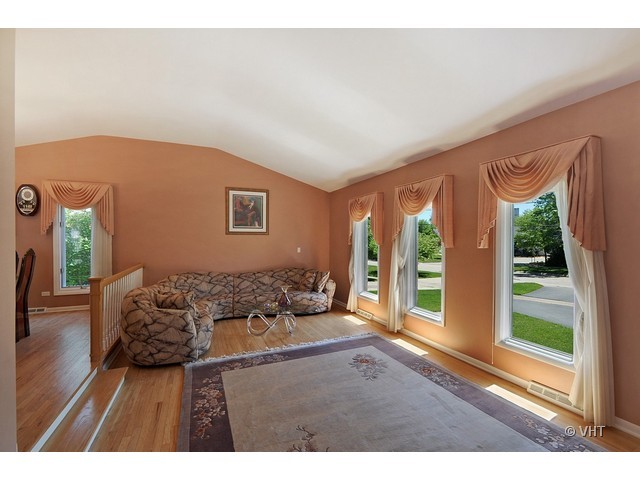 669 Ridge Road Highland Park, IL 60035 - Photo 3 of 16 a bed room with a bed and a large window