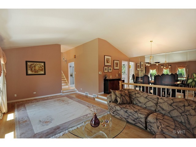 669 Ridge Road Highland Park, IL 60035 - Photo 4 of 16 a living room with furniture a fireplace and a table