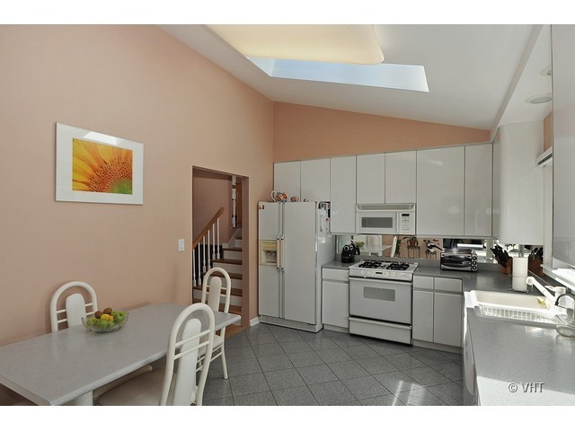 669 Ridge Road Highland Park, IL 60035 - Photo 6 of 16 a kitchen with stainless steel appliances granite countertop a stove a sink dishwasher and a refrigerator