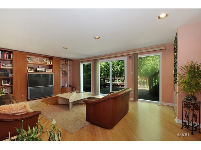 669 Ridge Road Highland Park, IL 60035 - Photo 8 of 16 a living room with furniture potted plant and a large window