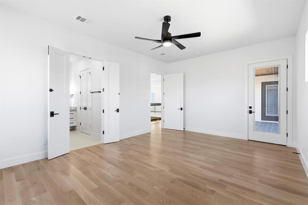 6257 Turner Way Dallas, TX 75230 - Photo 28 of 39 a view of empty room with wooden floor