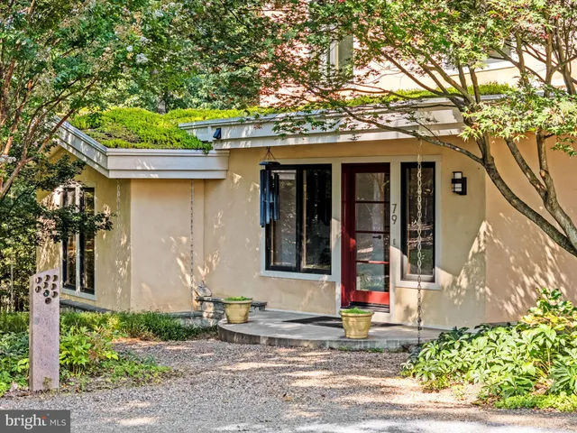 a view of a room with a large window and dining room