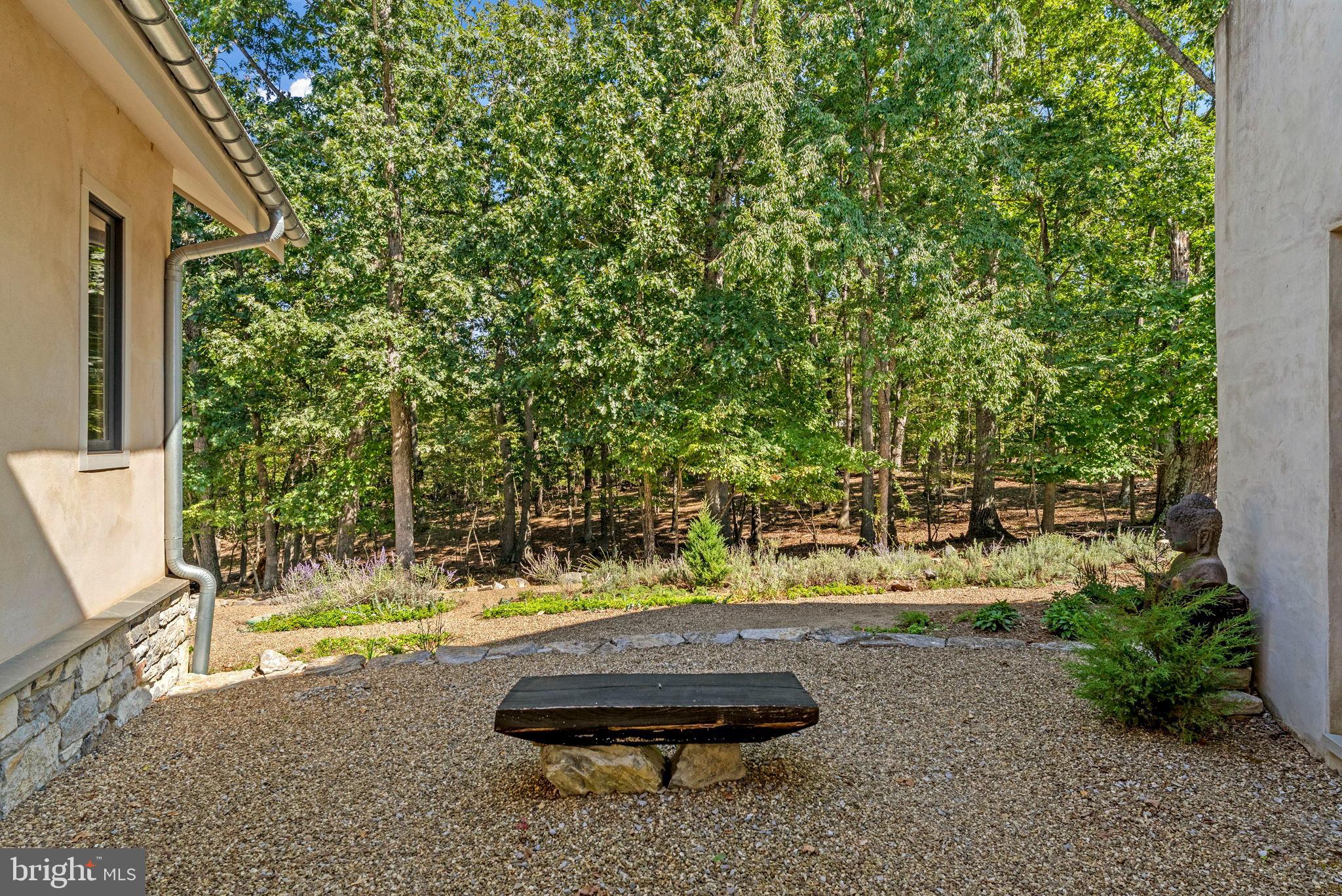 79 Marigold Way Gerrardstown, WV 25420 - Photo 12 of 140 a view of a backyard with plants and a patio