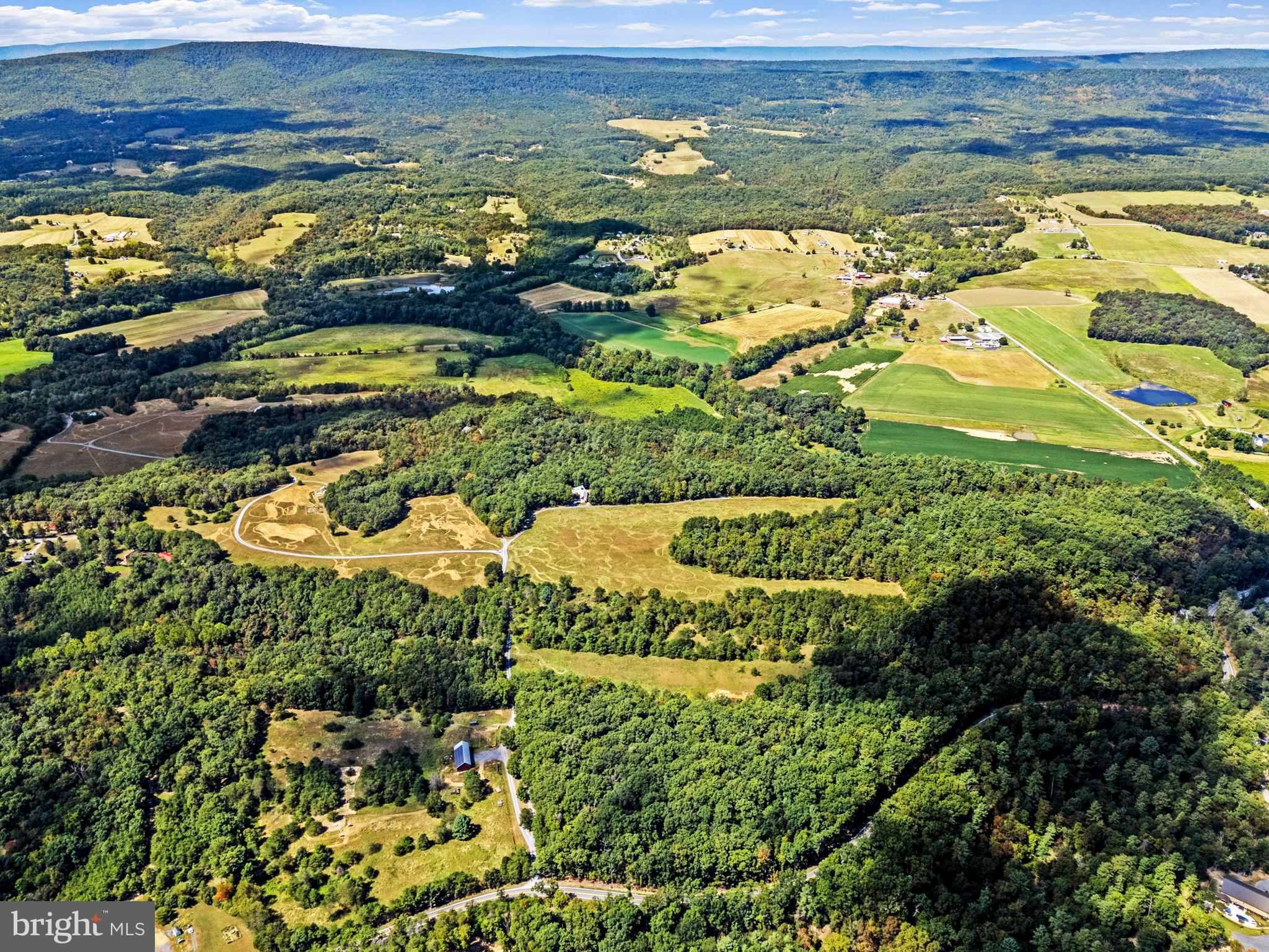 79 Marigold Way Gerrardstown, WV 25420 - Photo 134 of 140 Vast green landscapes under a clear sky.