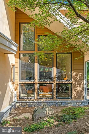 a view of a house with outdoor space and a lake view