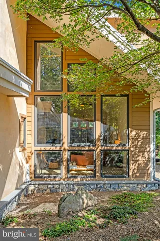 a view of a house with outdoor space and a lake view