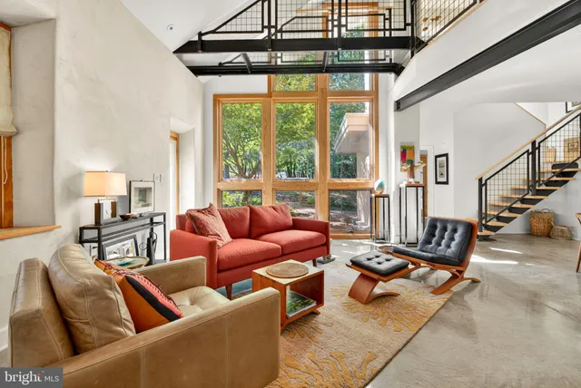 a view of a patio with table and chairs with wooden floor and fence