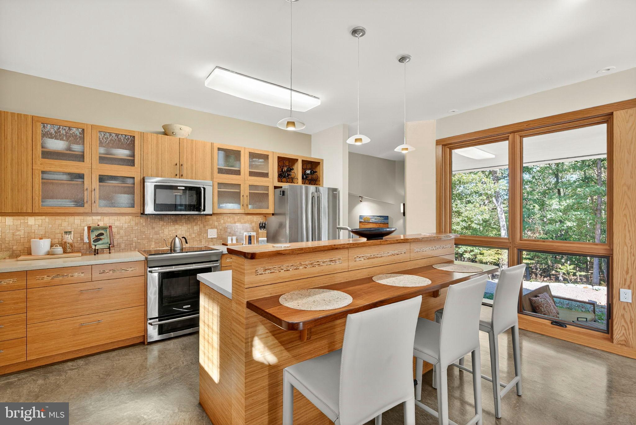 79 Marigold Way Gerrardstown, WV 25420 - Photo 33 of 140 a kitchen with stainless steel appliances granite countertop a stove a sink and a refrigerator