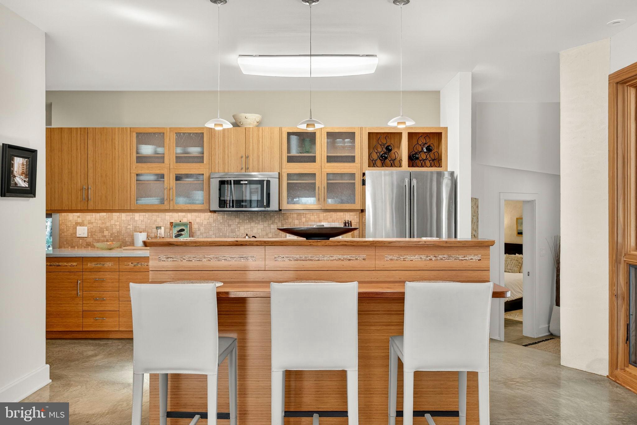 79 Marigold Way Gerrardstown, WV 25420 - Photo 34 of 140 Sleek modern kitchen with walnut accents.