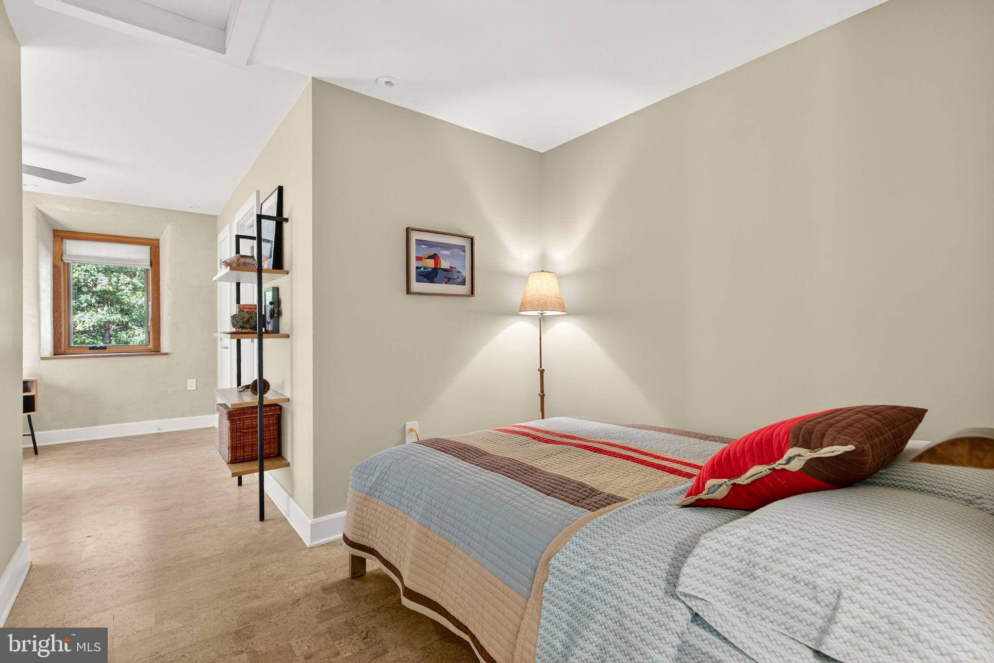 79 Marigold Way Gerrardstown, WV 25420 - Photo 77 of 140 a bedroom with a bed and a painting on the wall