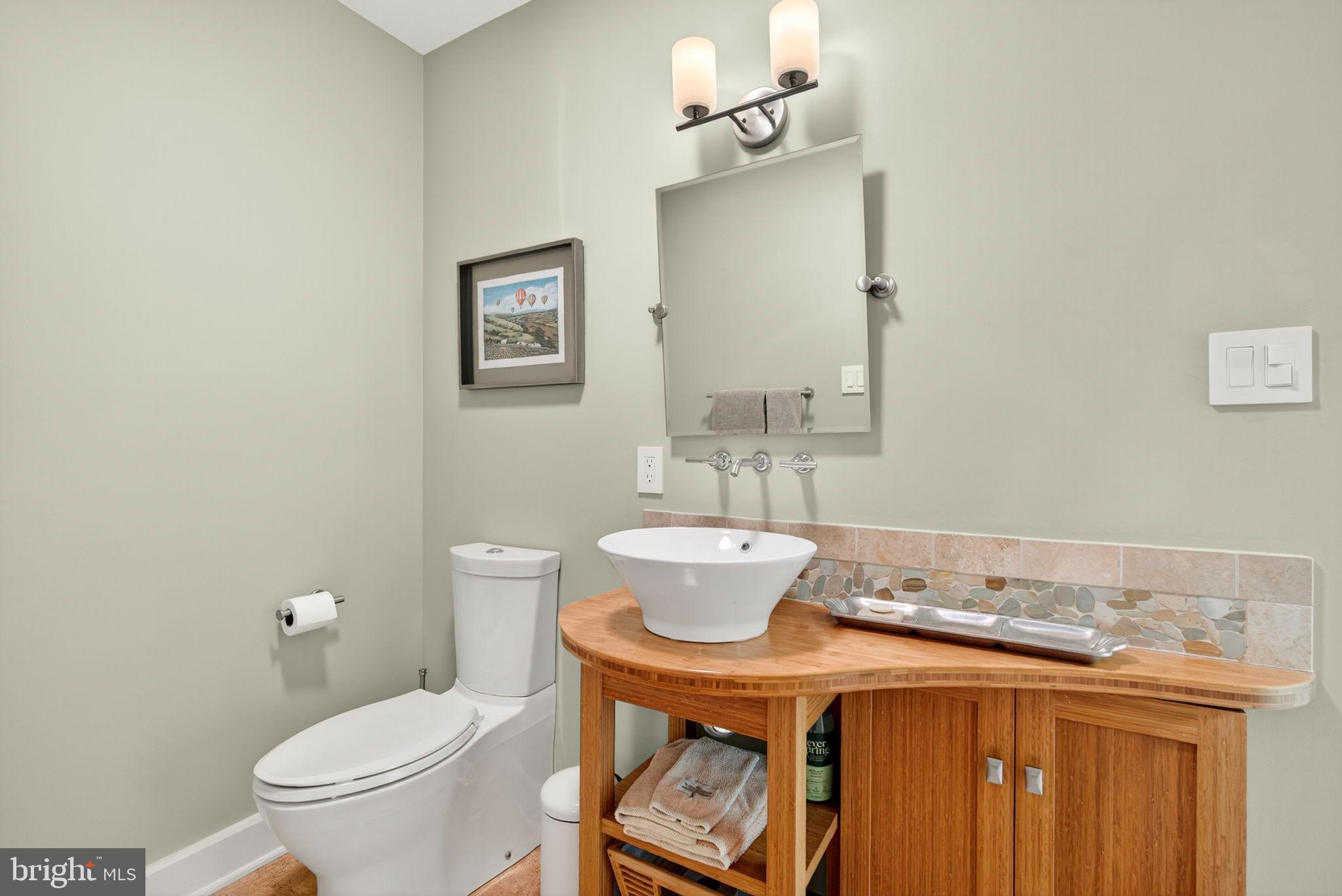 79 Marigold Way Gerrardstown, WV 25420 - Photo 93 of 140 a bathroom with a granite countertop toilet a sink and a mirror