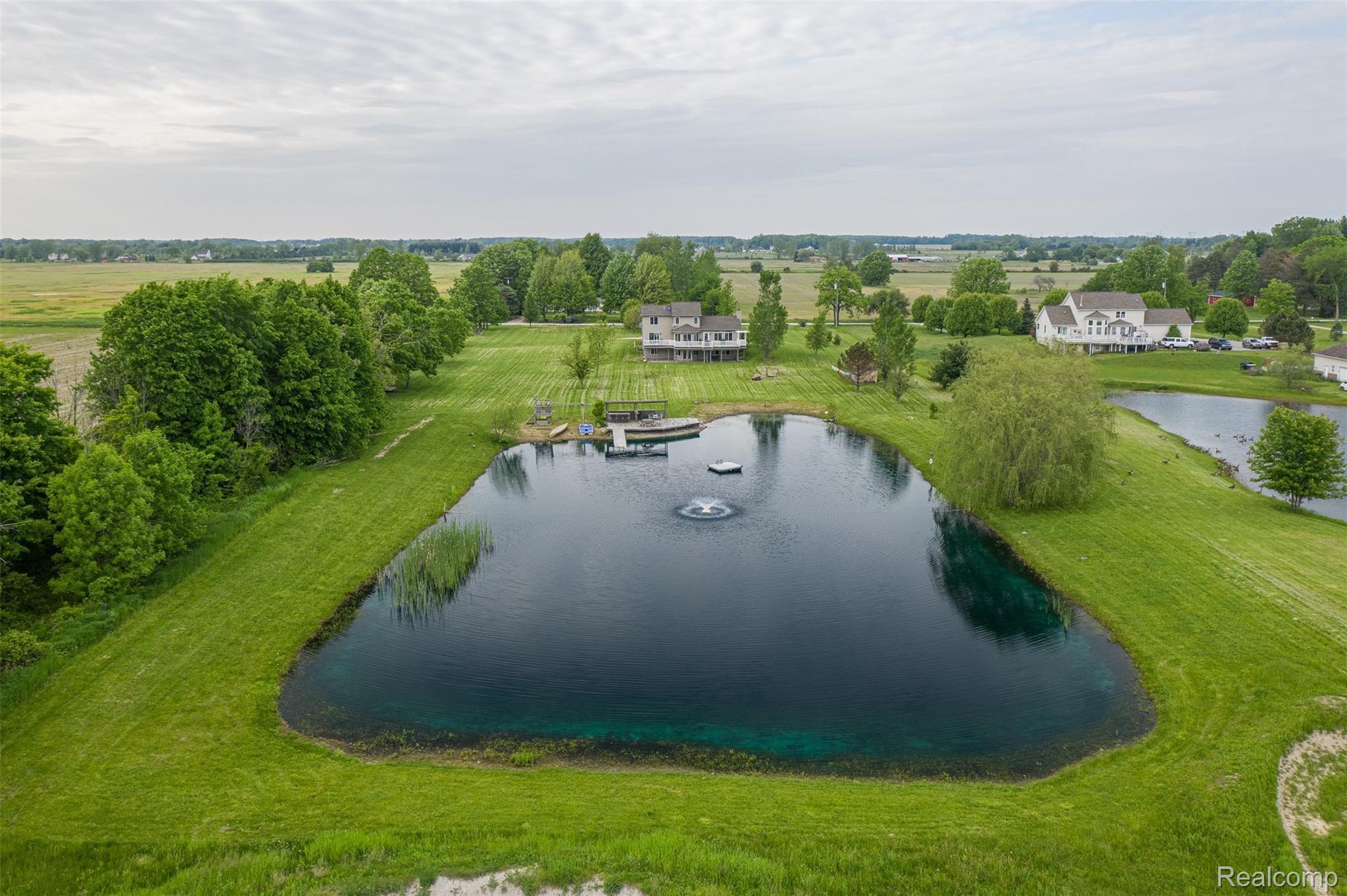 10151 Meskill Road Columbus, MI 48063 - Photo 37 of 39 Rear view of property from the pond.