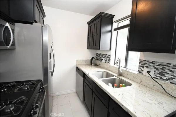 a close view of a utility room with dryer and washer