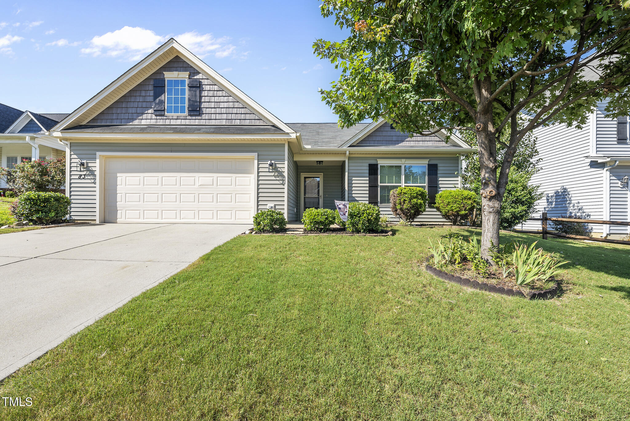 a front view of a house with a yard and porch
