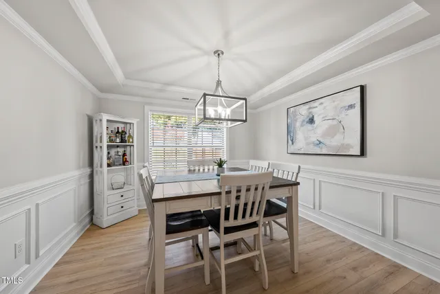 a bedroom with a bed dresser and a window