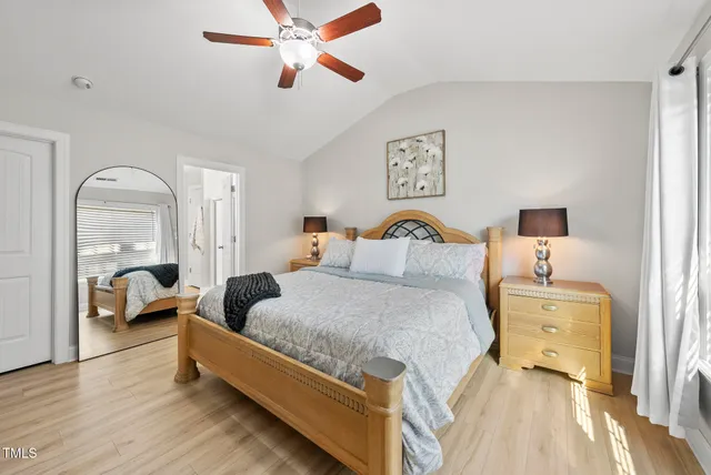 a bathroom with a double vanity sink mirror and shower